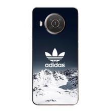 Чехлы Адидас для Nokia X10 (AlphaPrint) (Адидас в горах)